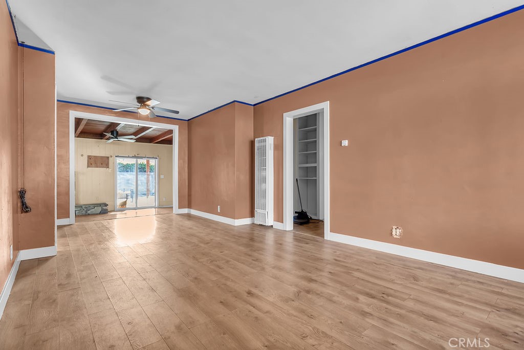 9734 Terradell Street Pico Rivera, CA 90660 - Photo 2 of 10 a view of an empty room with wooden floor and a window