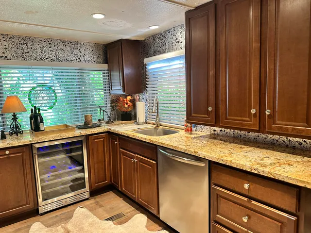 a kitchen with a sink and wooden cabinets