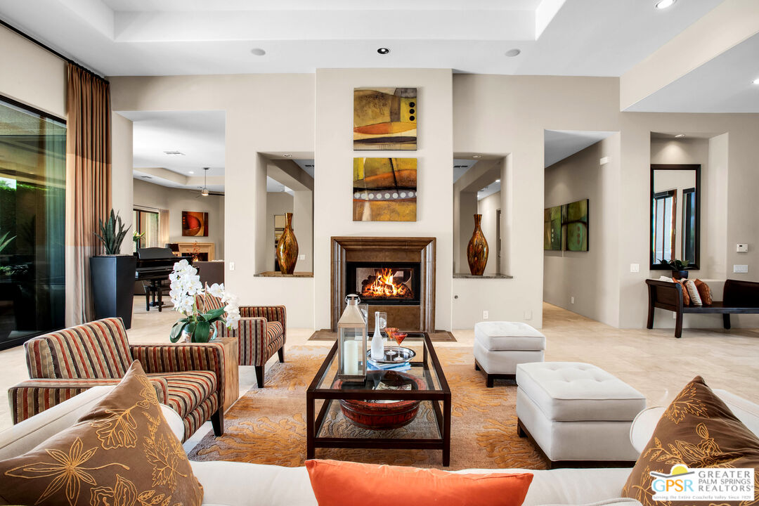39700 Keenan Drive Rancho Mirage, CA 92270 - Photo 26 of 69 a living room with furniture kitchen view and a fireplace