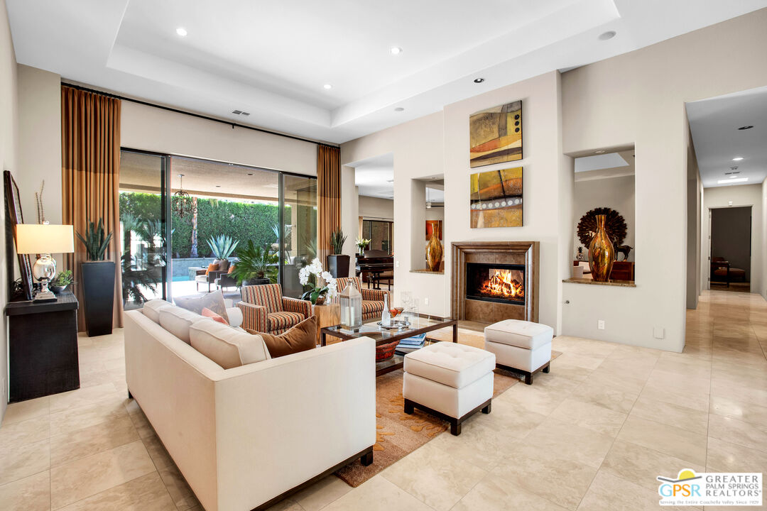 39700 Keenan Drive Rancho Mirage, CA 92270 - Photo 27 of 69 a living room with fireplace furniture and a large window