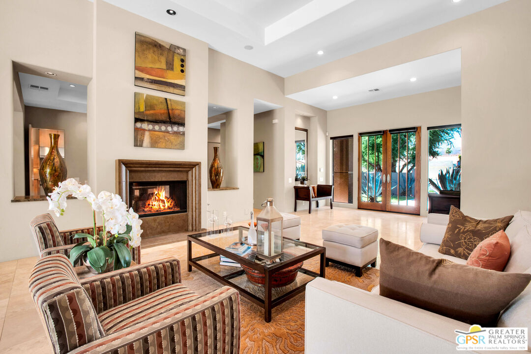 39700 Keenan Drive Rancho Mirage, CA 92270 - Photo 28 of 69 a living room with furniture and a fireplace