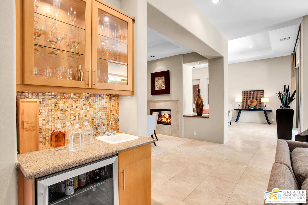 39700 Keenan Drive Rancho Mirage, CA 92270 - Photo 34 of 69 a view of a kitchen with granite countertop a sink and a refrigerator