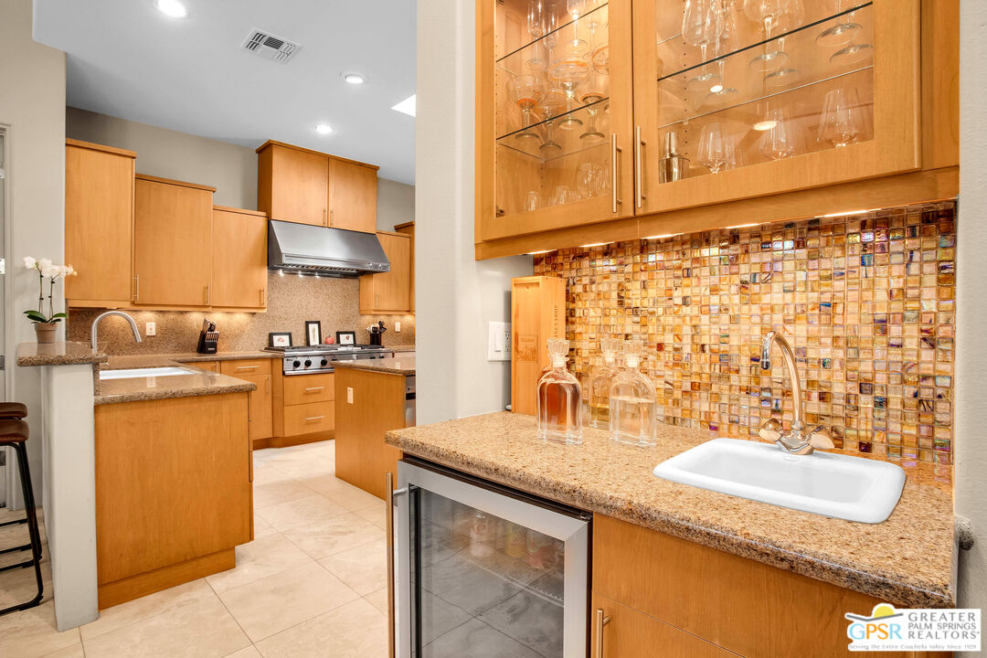 39700 Keenan Drive Rancho Mirage, CA 92270 - Photo 41 of 69 a kitchen with granite countertop sink and cabinets