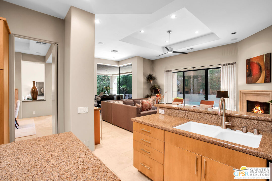 39700 Keenan Drive Rancho Mirage, CA 92270 - Photo 42 of 69 a large white kitchen with a large window a sink and a counter top space