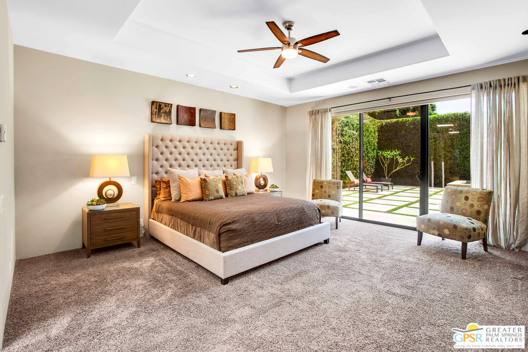 39700 Keenan Drive Rancho Mirage, CA 92270 - Photo 48 of 69 a bedroom with a bed and a large window with outer view