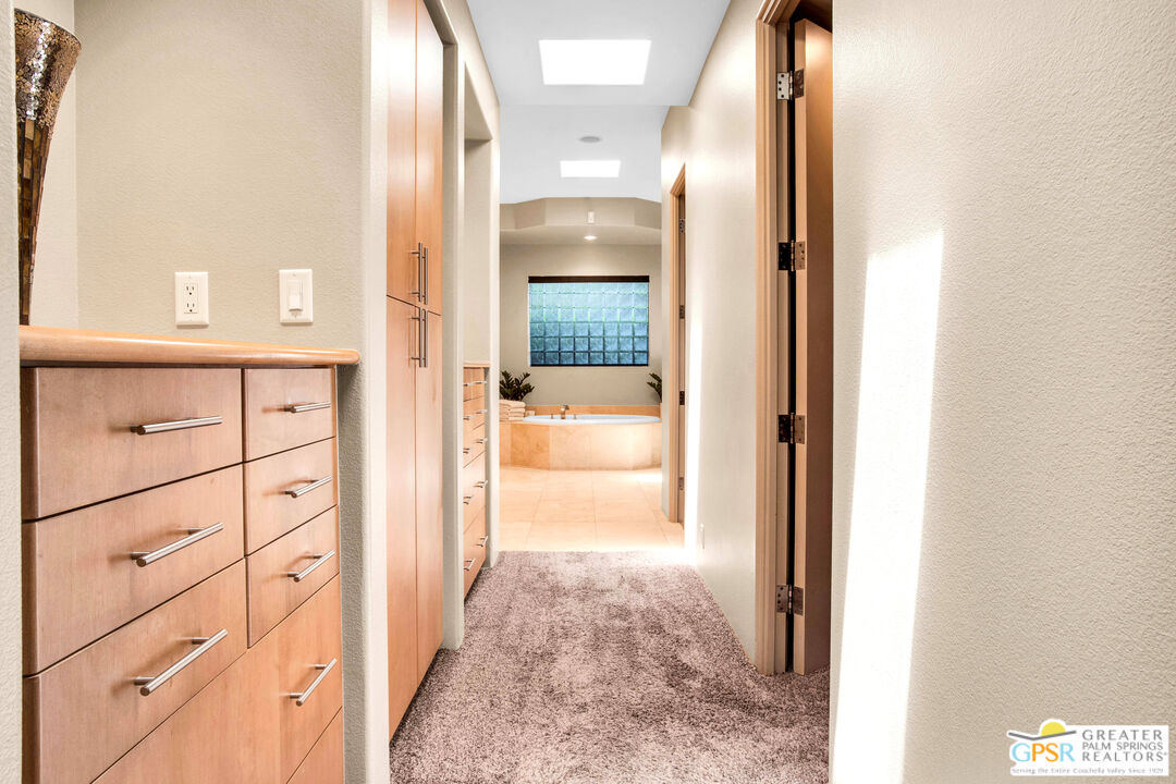 39700 Keenan Drive Rancho Mirage, CA 92270 - Photo 54 of 69 a view of a hallway with wooden floor windows and a bathroom