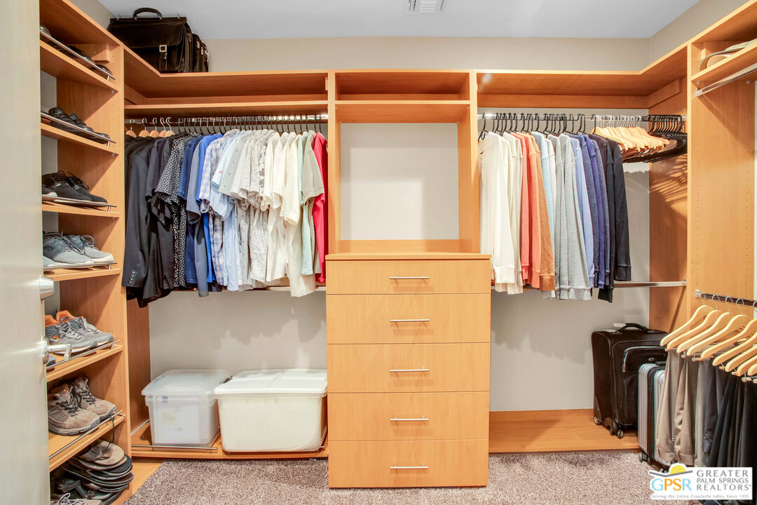 39700 Keenan Drive Rancho Mirage, CA 92270 - Photo 55 of 69 a view of walk in closet with clothes and shoes