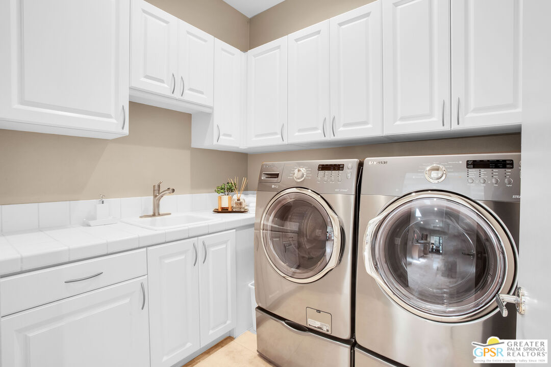 39700 Keenan Drive Rancho Mirage, CA 92270 - Photo 63 of 69 a utility room with sink dryer and washer