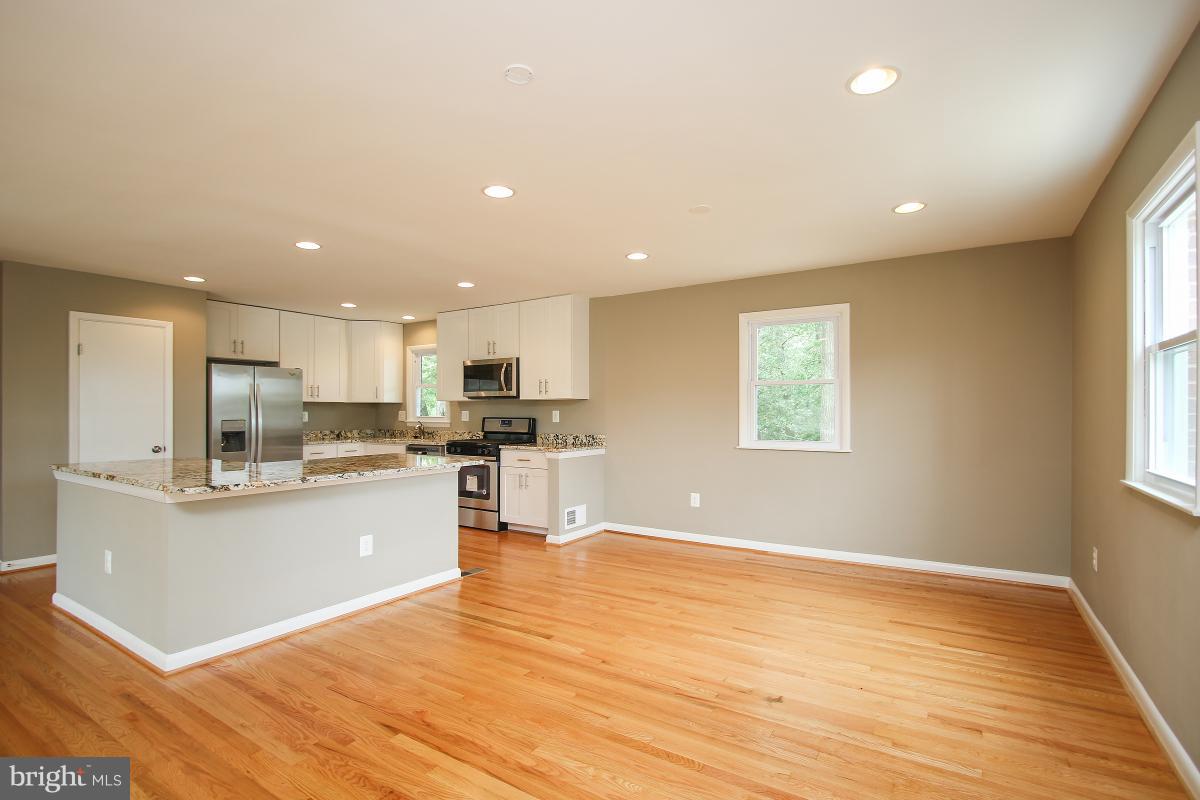 6903 Presley Road Lanham, MD 20706 - Photo 6 of 28 a view of kitchen with wooden floor and electronic appliances