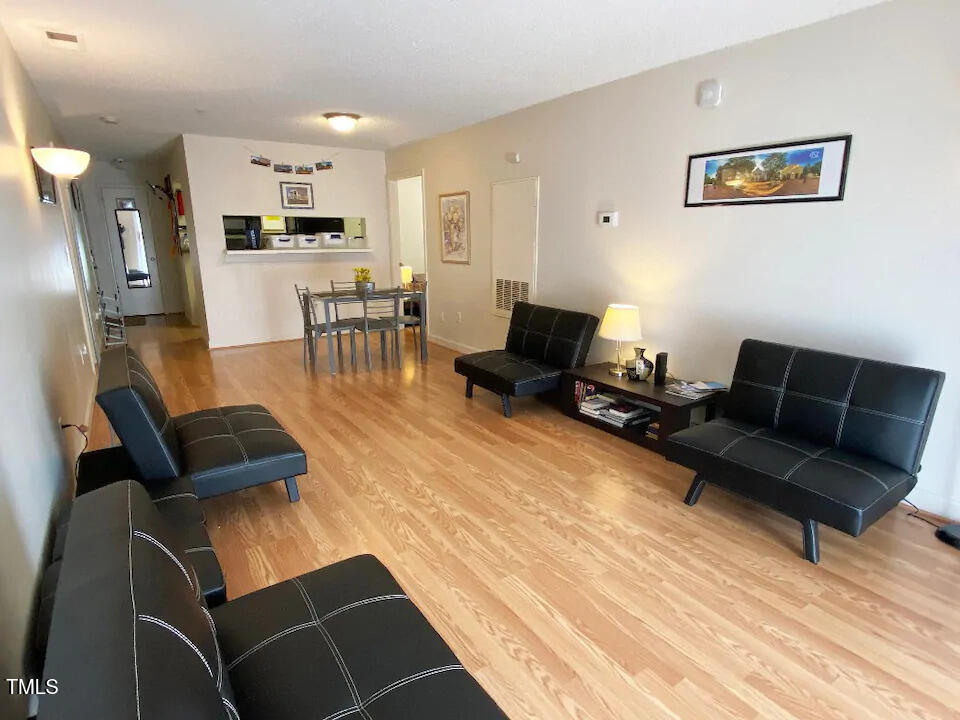 a living room with furniture and a table