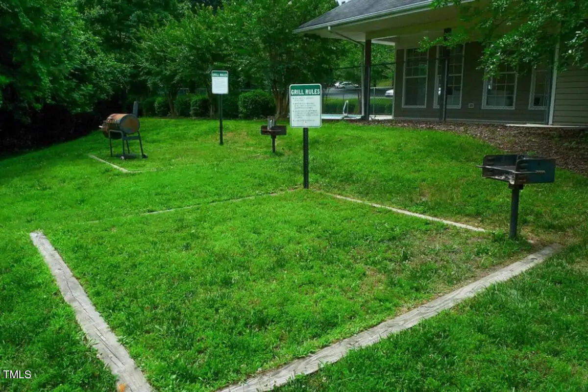 303 Smith Level Road, Unit E33 Chapel Hill, NC 27516 - Photo 22 of 25 a view of a house with backyard