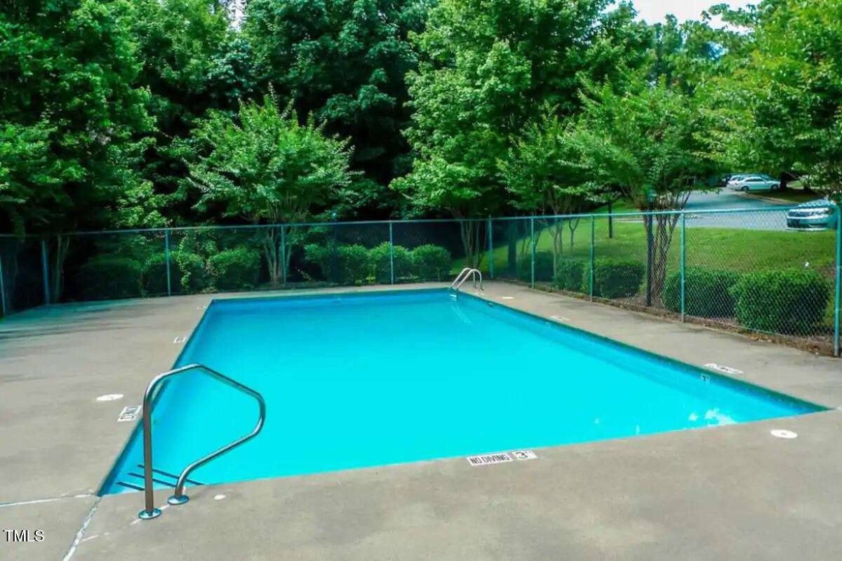 303 Smith Level Road, Unit E33 Chapel Hill, NC 27516 - Photo 23 of 25 a view of a backyard with a small pool