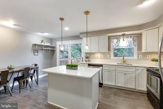 a view of a bathroom with a toilet and a shower