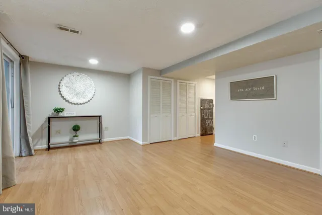 a view of a livingroom with furniture and a window