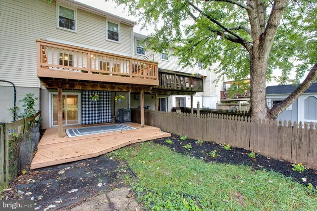 a view of a porch with wooden floor