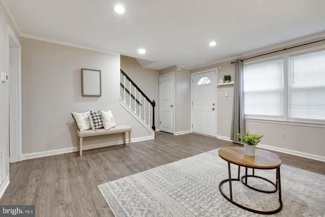 a view of a livingroom with furniture and wooden floor