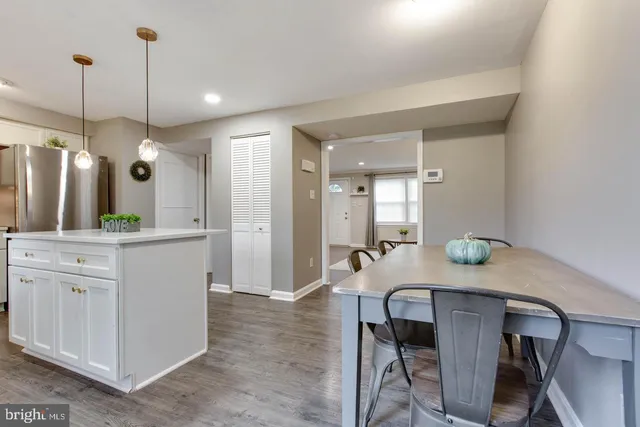 a kitchen with a table and chairs in it