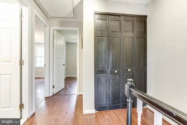 a bathroom with a granite countertop sink a toilet and a mirror
