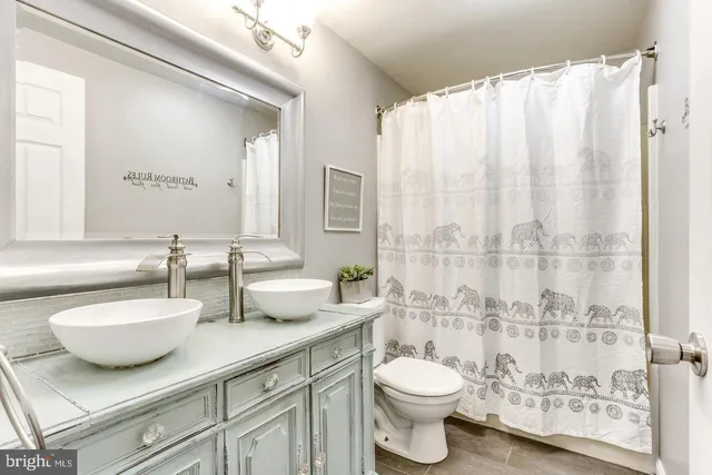 a bedroom with a bed and a lamp