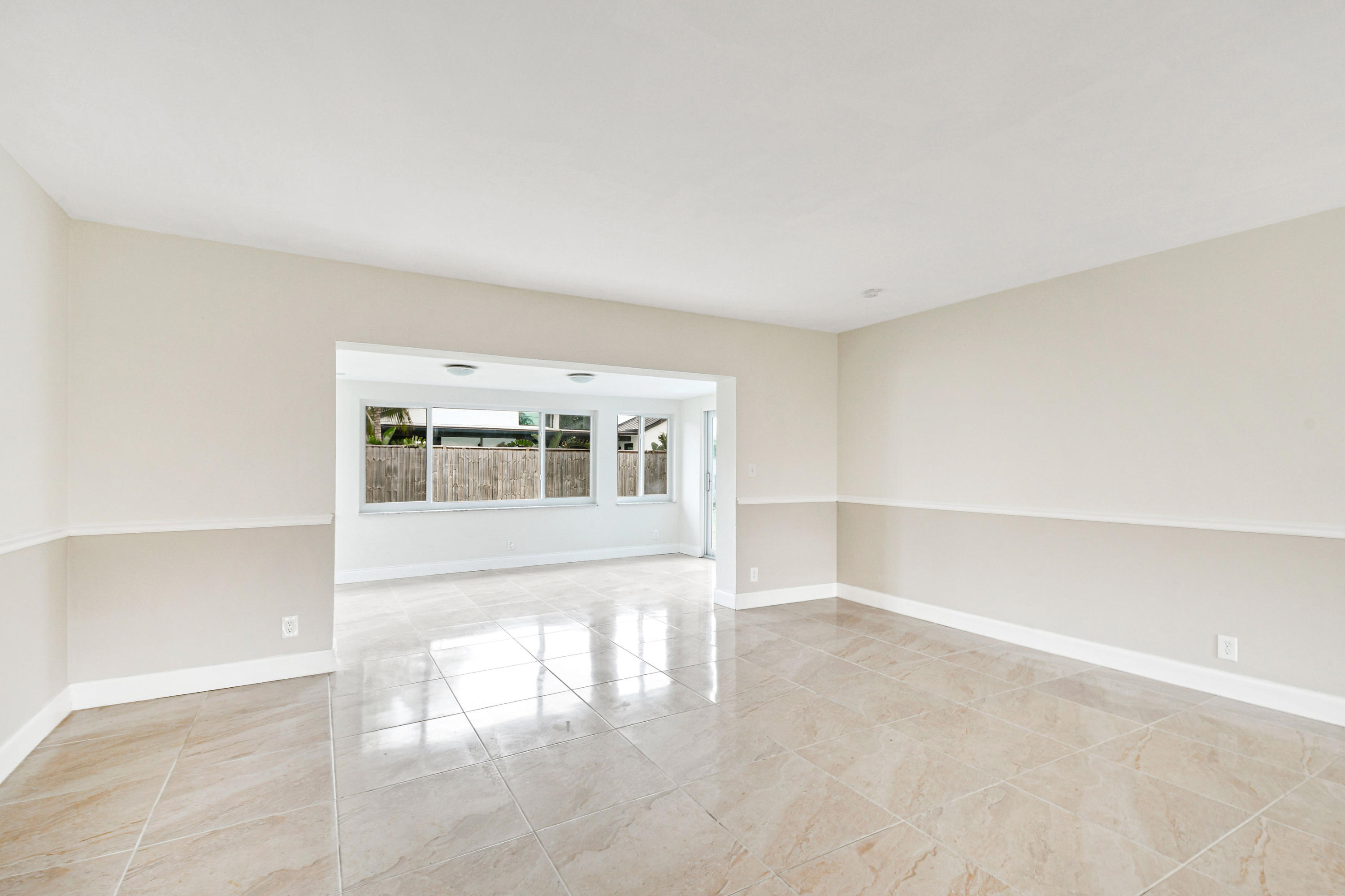 2003 Park Place Boca Raton, FL 33486 - Photo 9 of 42 a view of empty room with wooden floor and fan