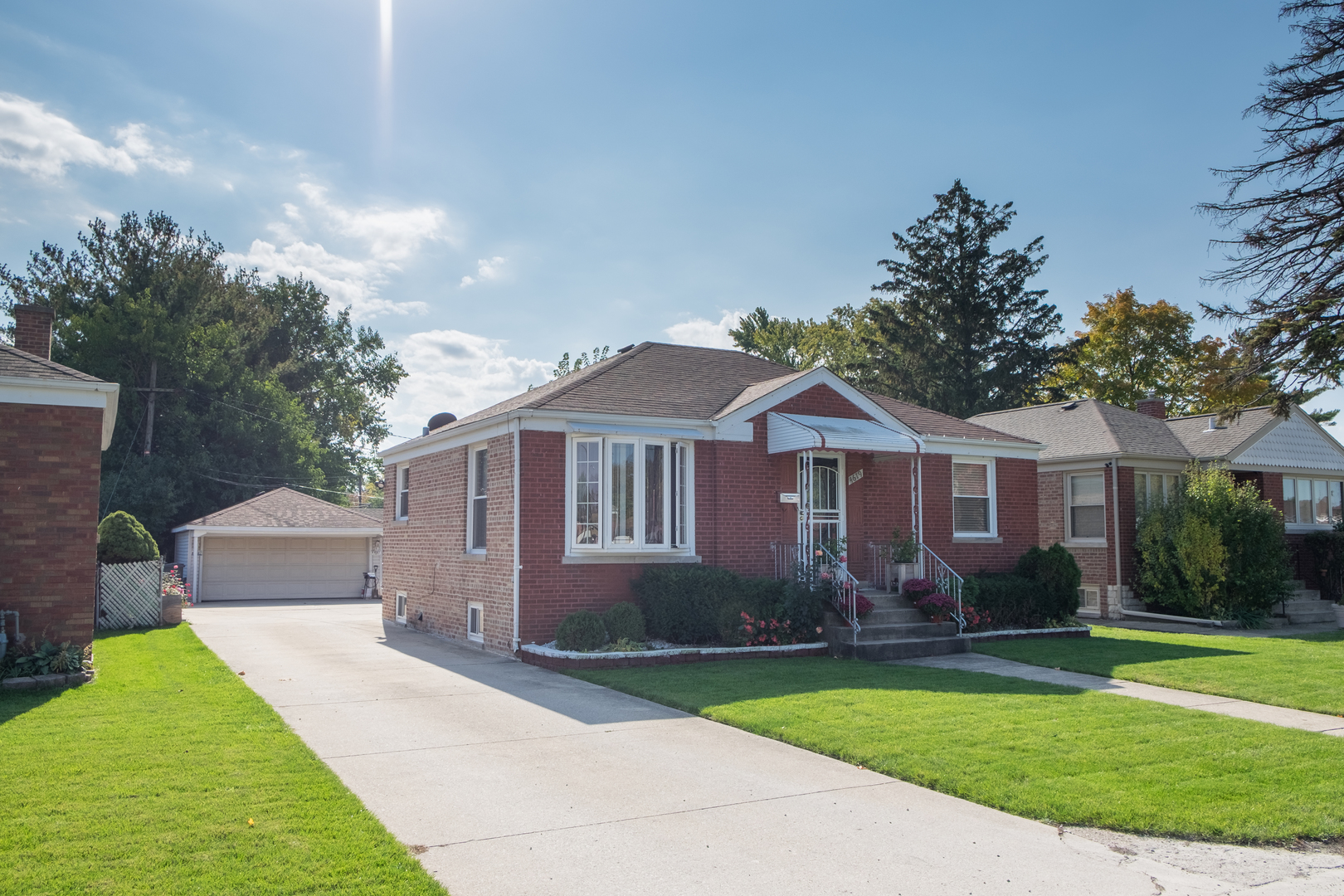 4619 Butterfield Road Hillside, IL 60162 - Photo 1 of 52 a front view of a house with garden