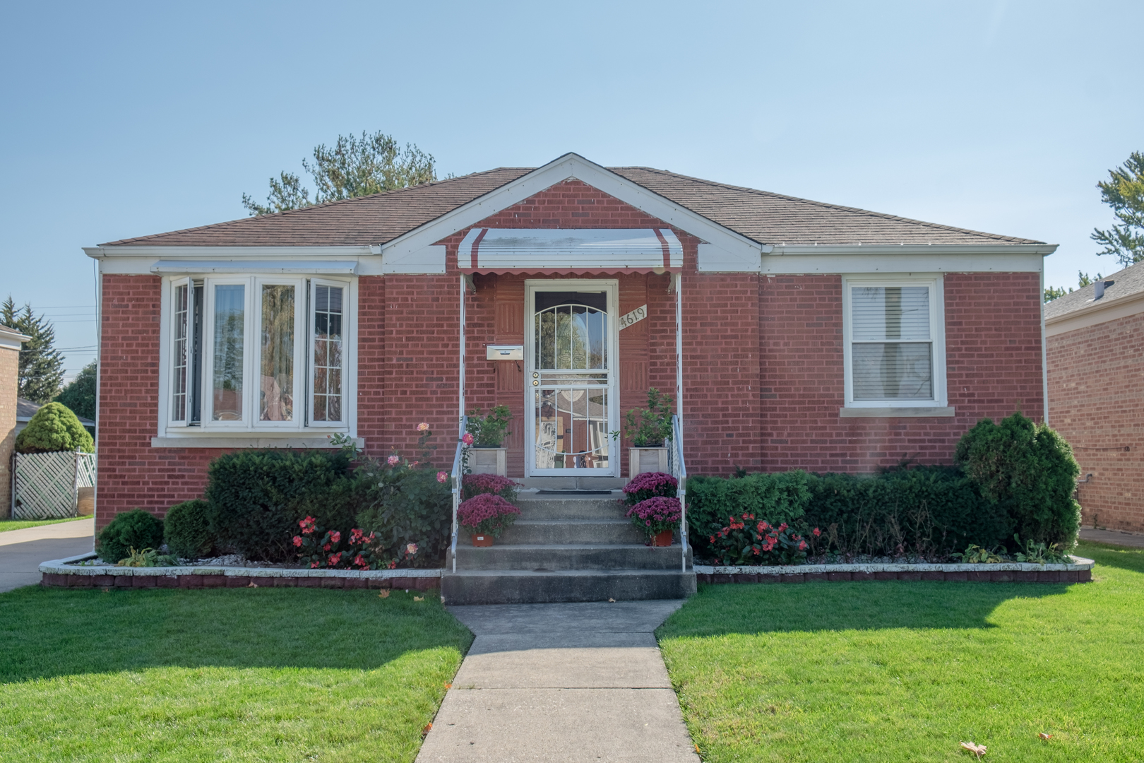 4619 Butterfield Road Hillside, IL 60162 - Photo 2 of 52 a front view of a house with garden