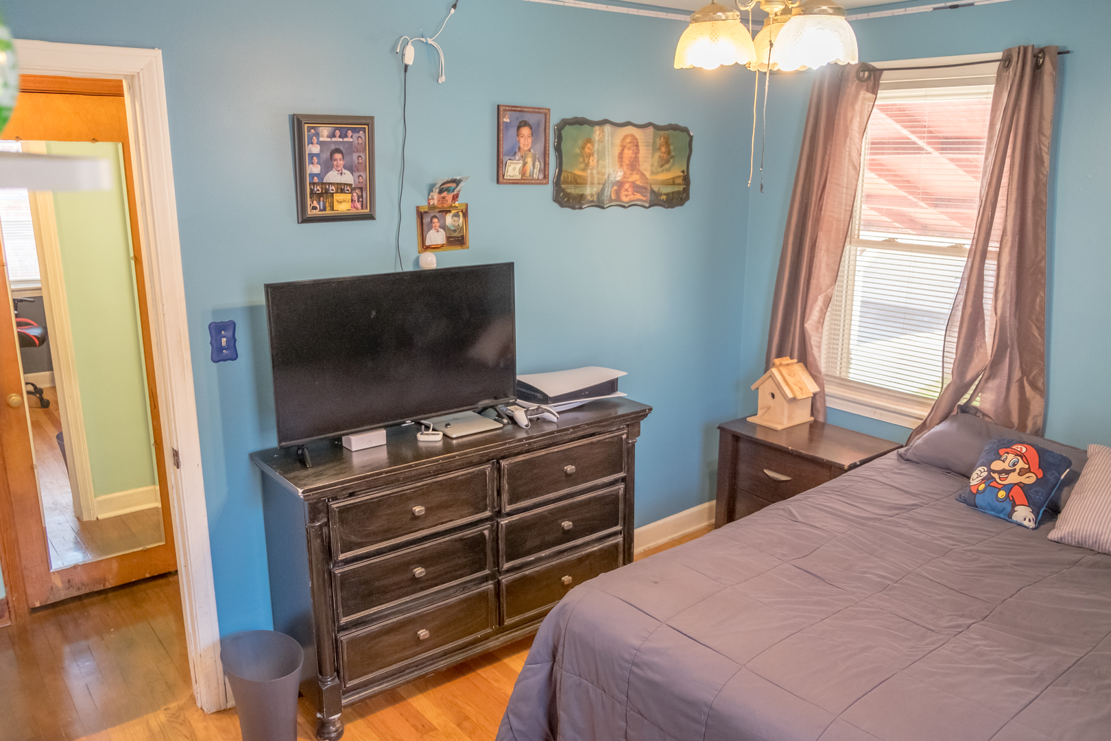 4619 Butterfield Road Hillside, IL 60162 - Photo 21 of 52 a bedroom with a bed and a flat tv screen on dresser