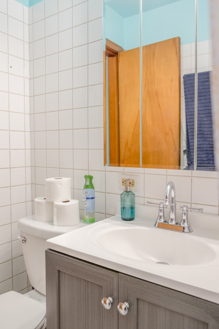4619 Butterfield Road Hillside, IL 60162 - Photo 27 of 52 a bathroom with a sink and a toilet