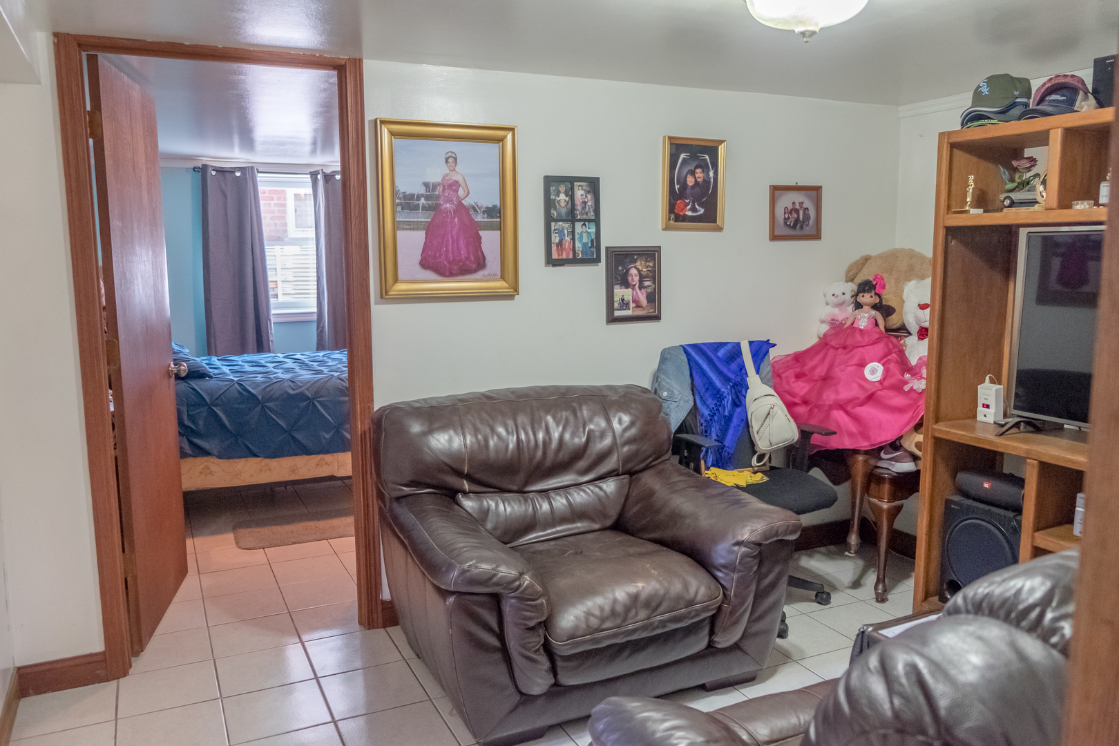4619 Butterfield Road Hillside, IL 60162 - Photo 35 of 52 a living room with furniture and a flat screen tv