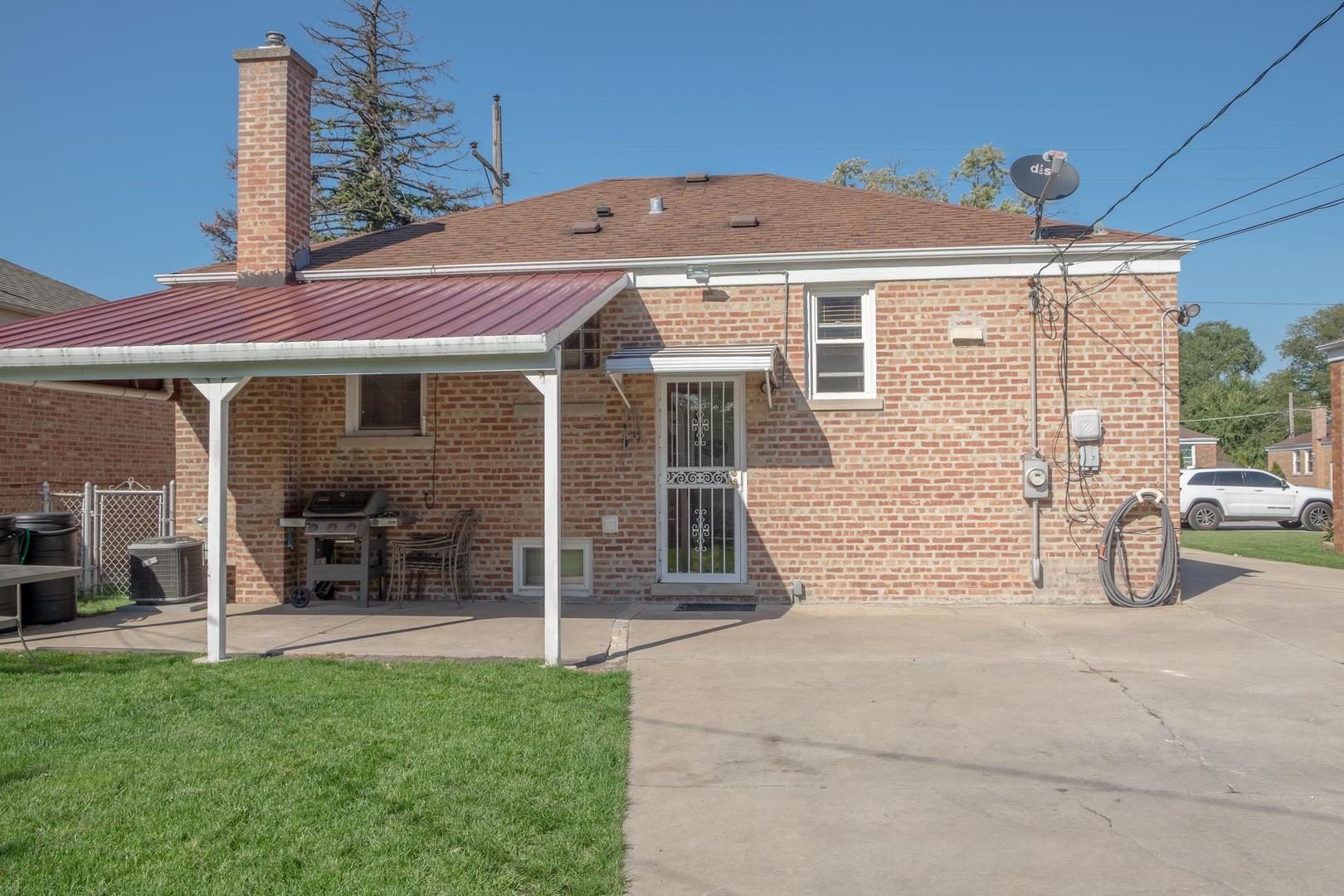 4619 Butterfield Road Hillside, IL 60162 - Photo 47 of 52 a front view of a house with a garden and porch