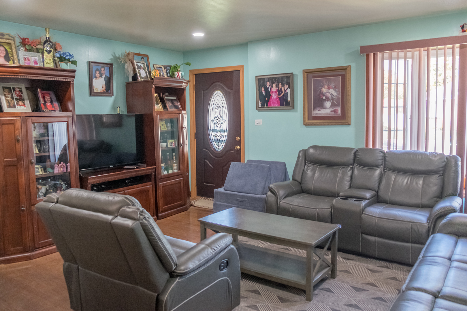 4619 Butterfield Road Hillside, IL 60162 - Photo 6 of 52 a living room with furniture and a flat screen tv