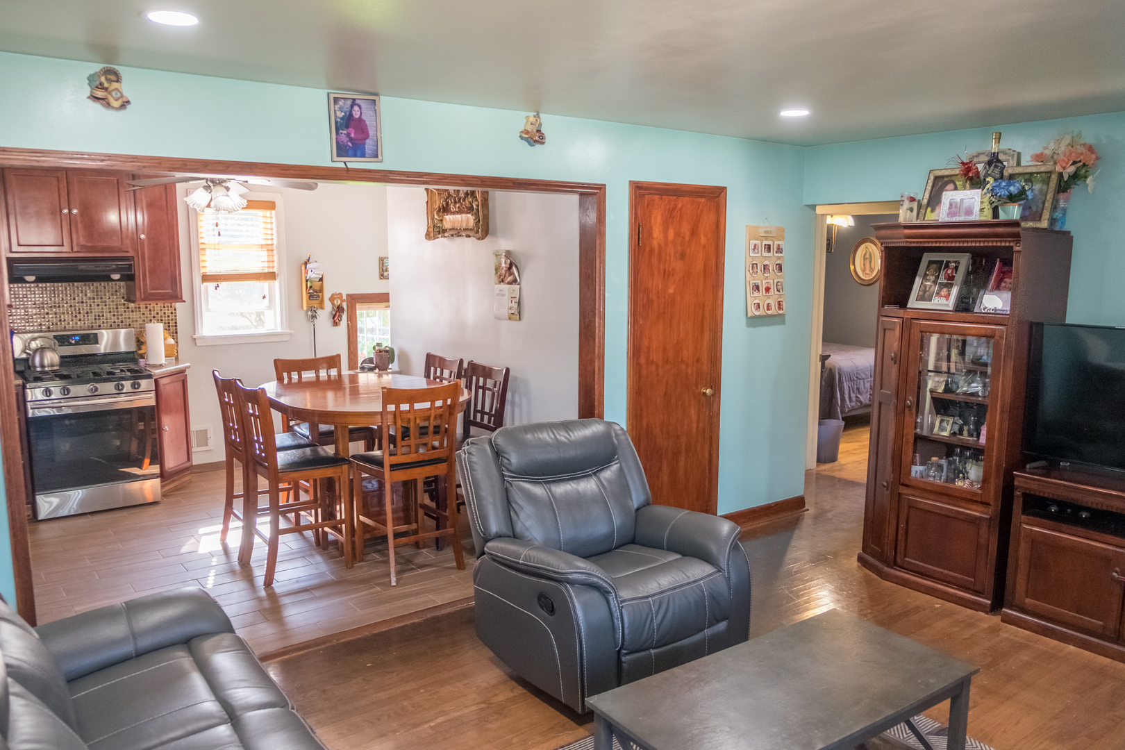 4619 Butterfield Road Hillside, IL 60162 - Photo 8 of 52 a dining room with furniture and a flat screen tv
