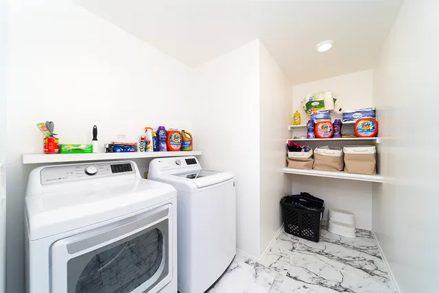 a utility room with dryer and washer