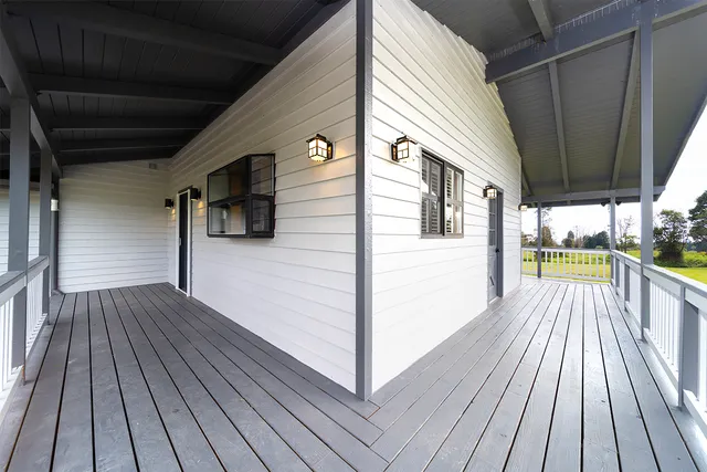 a view of a balcony with wooden floor