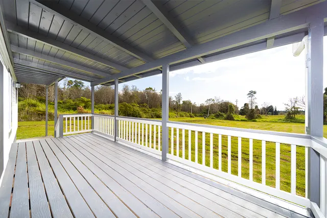 a view of balcony with wooden floor