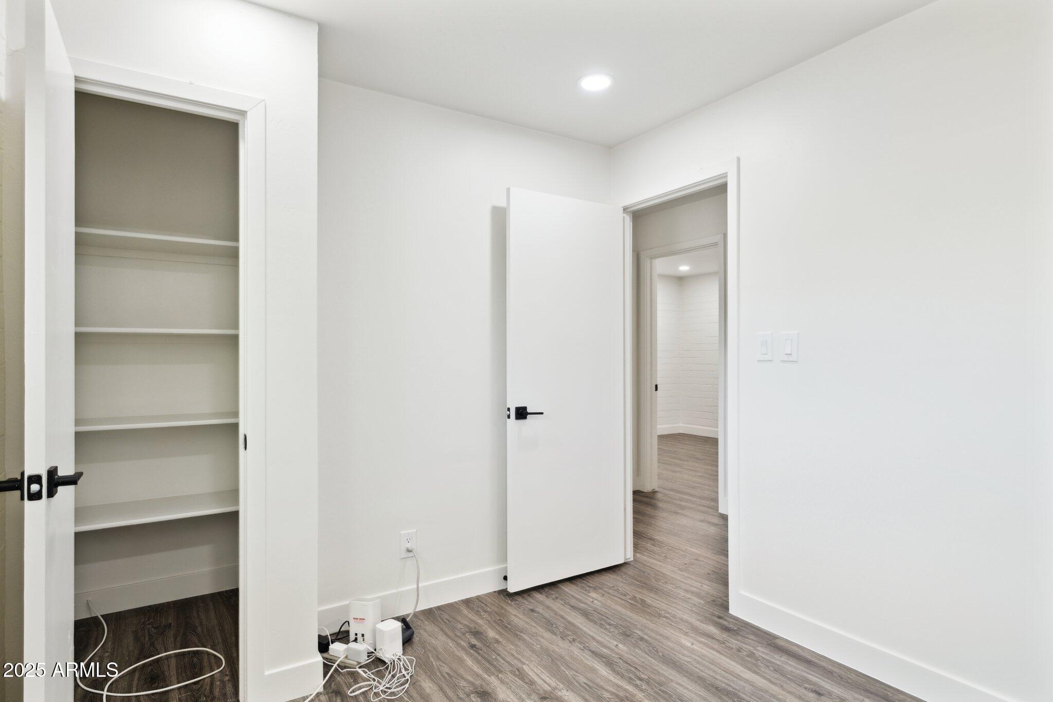1542 East Turquoise Avenue, Unit 1 Phoenix, AZ 85020 - Photo 20 of 25 a view of a hallway with wooden floor