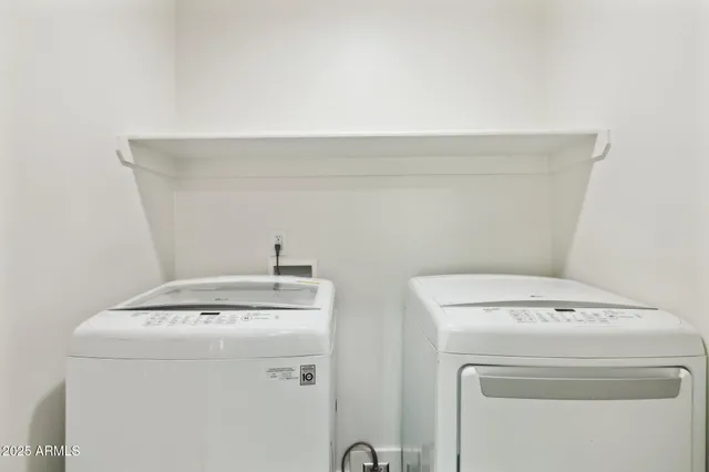 a utility room with dryer and washer