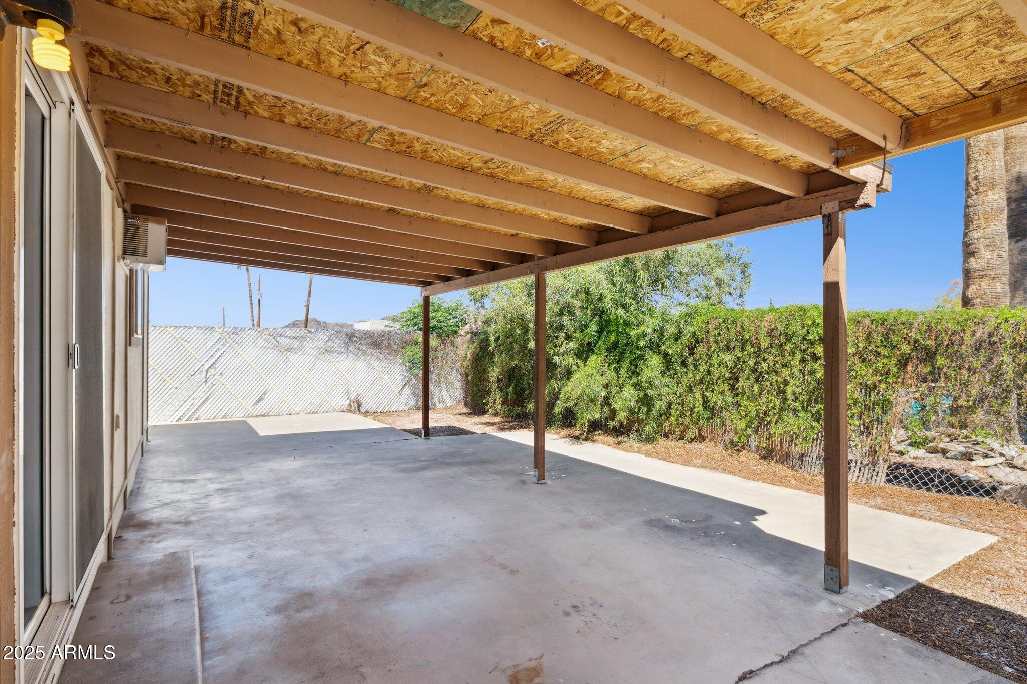 1542 East Turquoise Avenue, Unit 1 Phoenix, AZ 85020 - Photo 22 of 25 a view of a room with wooden floor