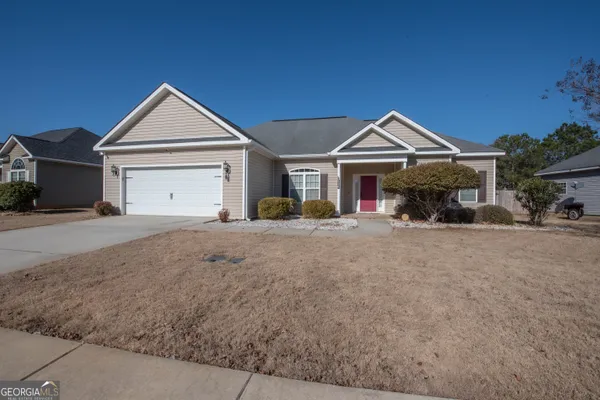 a front view of a house with a yard