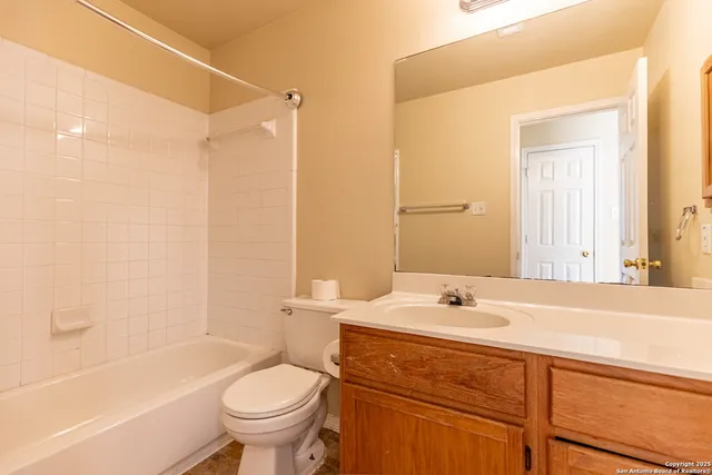 a bathroom with a sink a toilet and a bathtub
