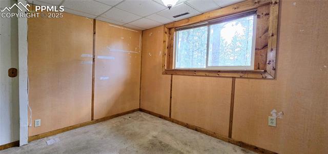11785 Milam Road Colorado Springs, CO 80908 - Photo 25 of 44 Unfurnished room with baseboards and a drop ceiling