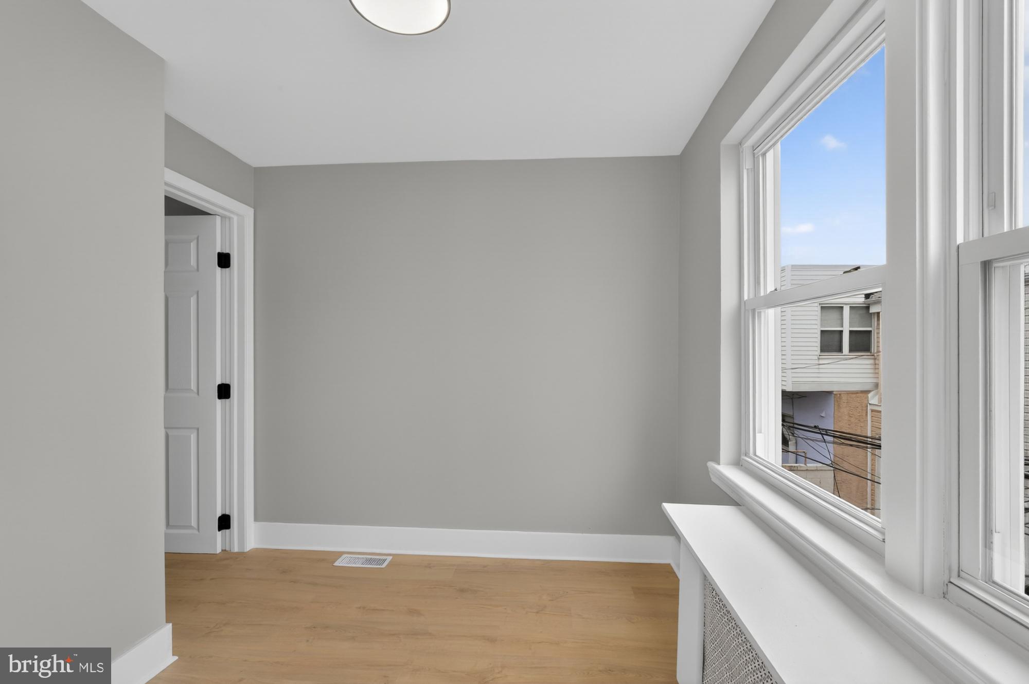 1908 South Jessup Street Philadelphia, PA 19148 - Photo 16 of 28 a view of wooden floor and windows in a room