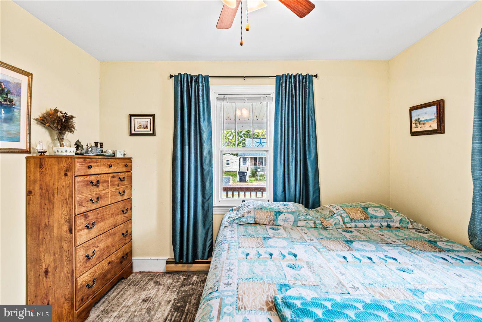 314 Lafayette Street Colonial Beach, VA 22443 - Photo 18 of 41 a bedroom with a bed and wooden floor