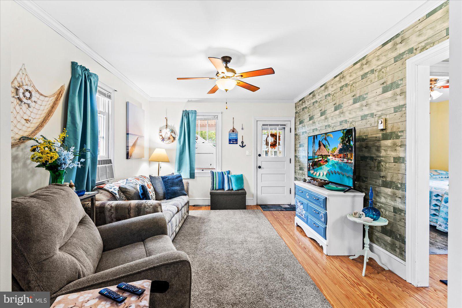 314 Lafayette Street Colonial Beach, VA 22443 - Photo 7 of 41 a living room with furniture and a flat screen tv