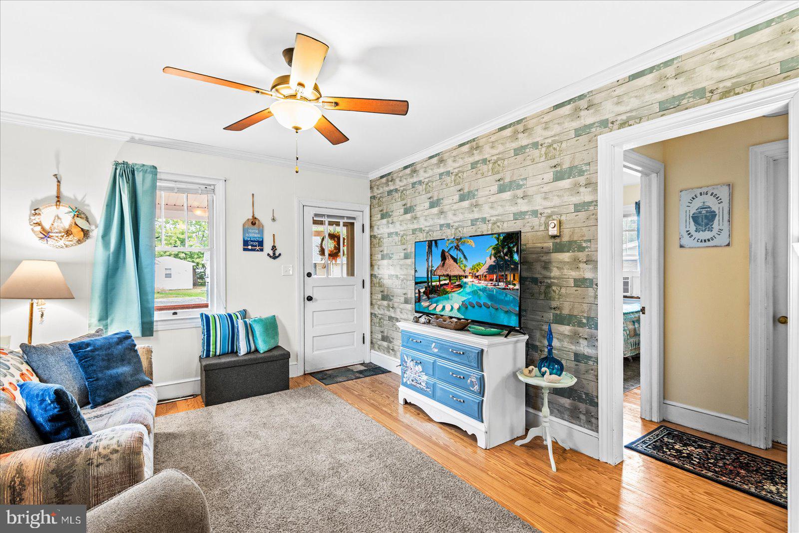 314 Lafayette Street Colonial Beach, VA 22443 - Photo 8 of 41 a living room with furniture and a flat screen tv