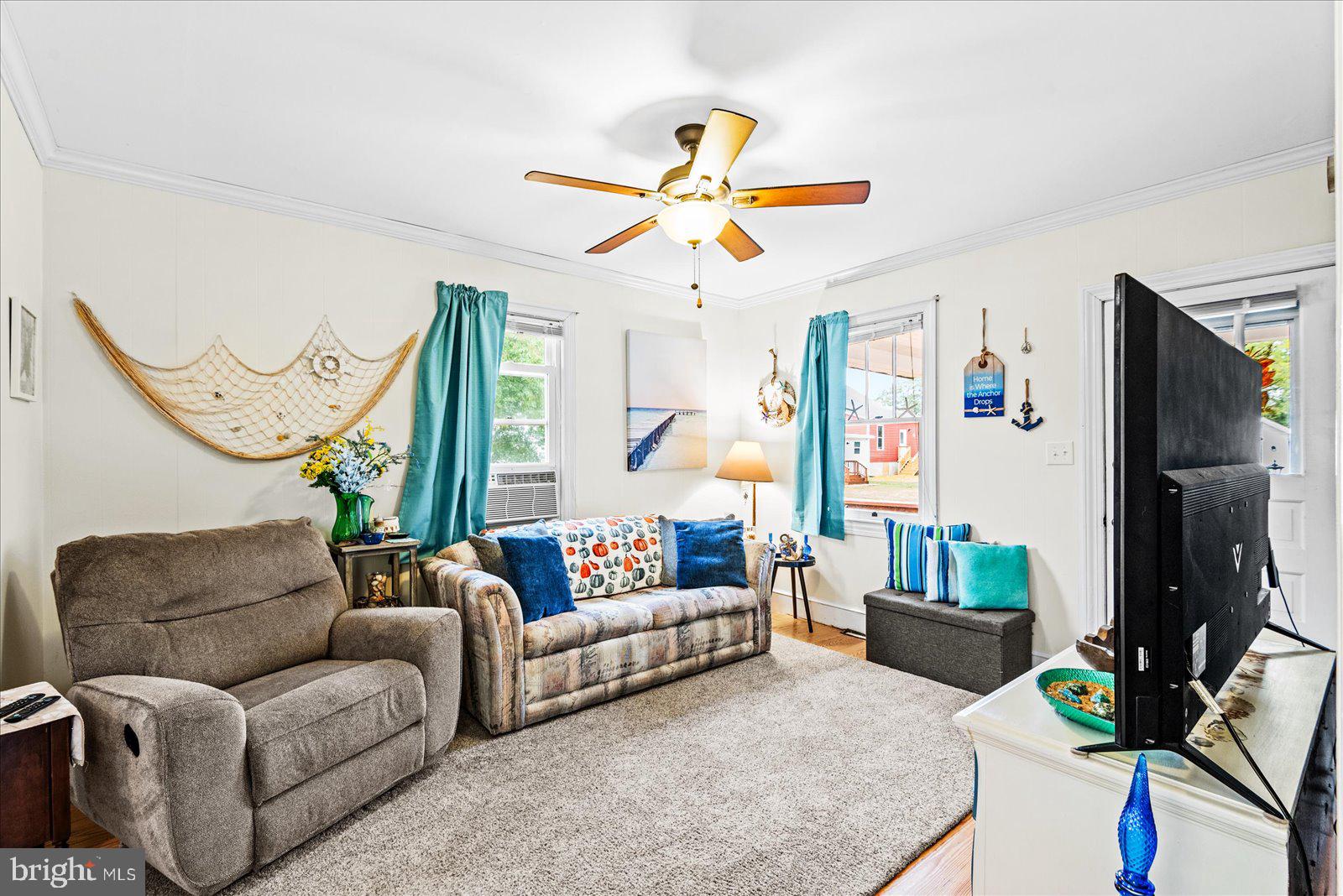 314 Lafayette Street Colonial Beach, VA 22443 - Photo 9 of 41 a living room with furniture and a flat screen tv