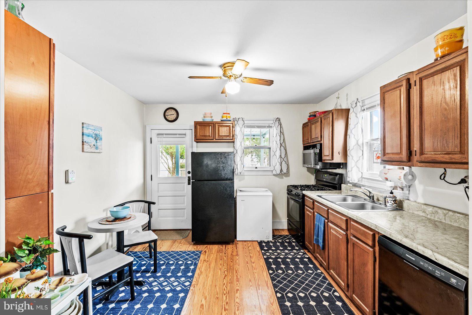 314 Lafayette Street Colonial Beach, VA 22443 - Photo 10 of 41 a kitchen with a refrigerator and a stove