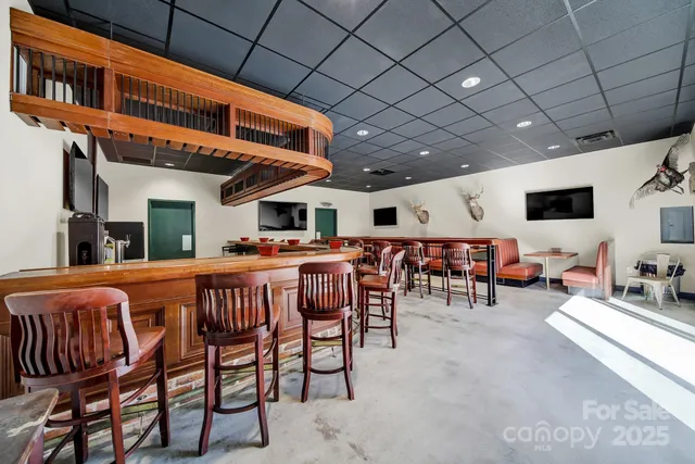 a dinning table and chairs in a room