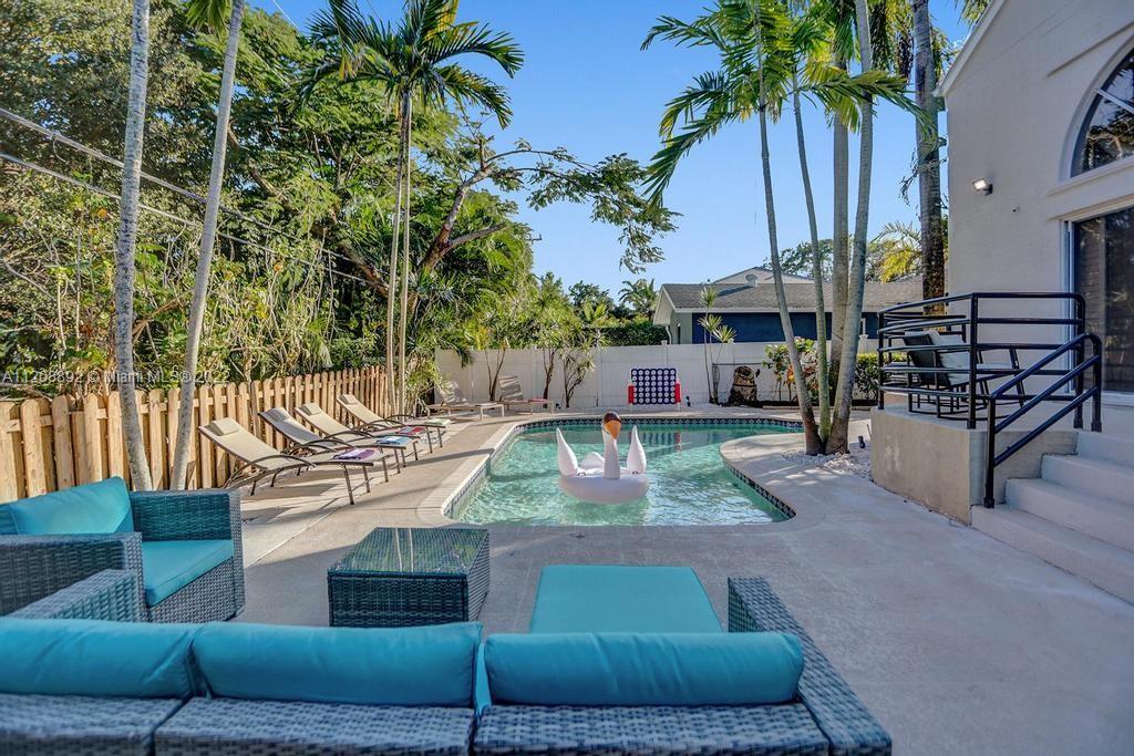 960 Northwest 4th Court Boca Raton, FL 33432 - Photo 1 of 75 a view of outdoor space yard deck patio and swimming pool