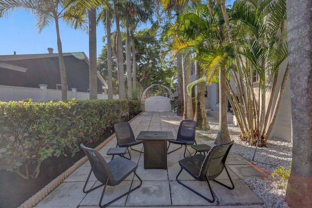 960 Northwest 4th Court Boca Raton, FL 33432 - Photo 12 of 75 a view of a chairs and table in patio